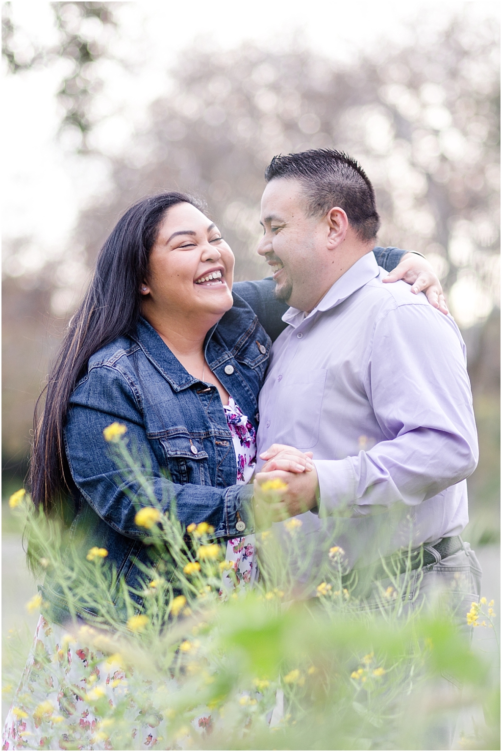 Couple laughing at Vallejo Mills Historical Park near Niles Canyon, standing in the wildflowers