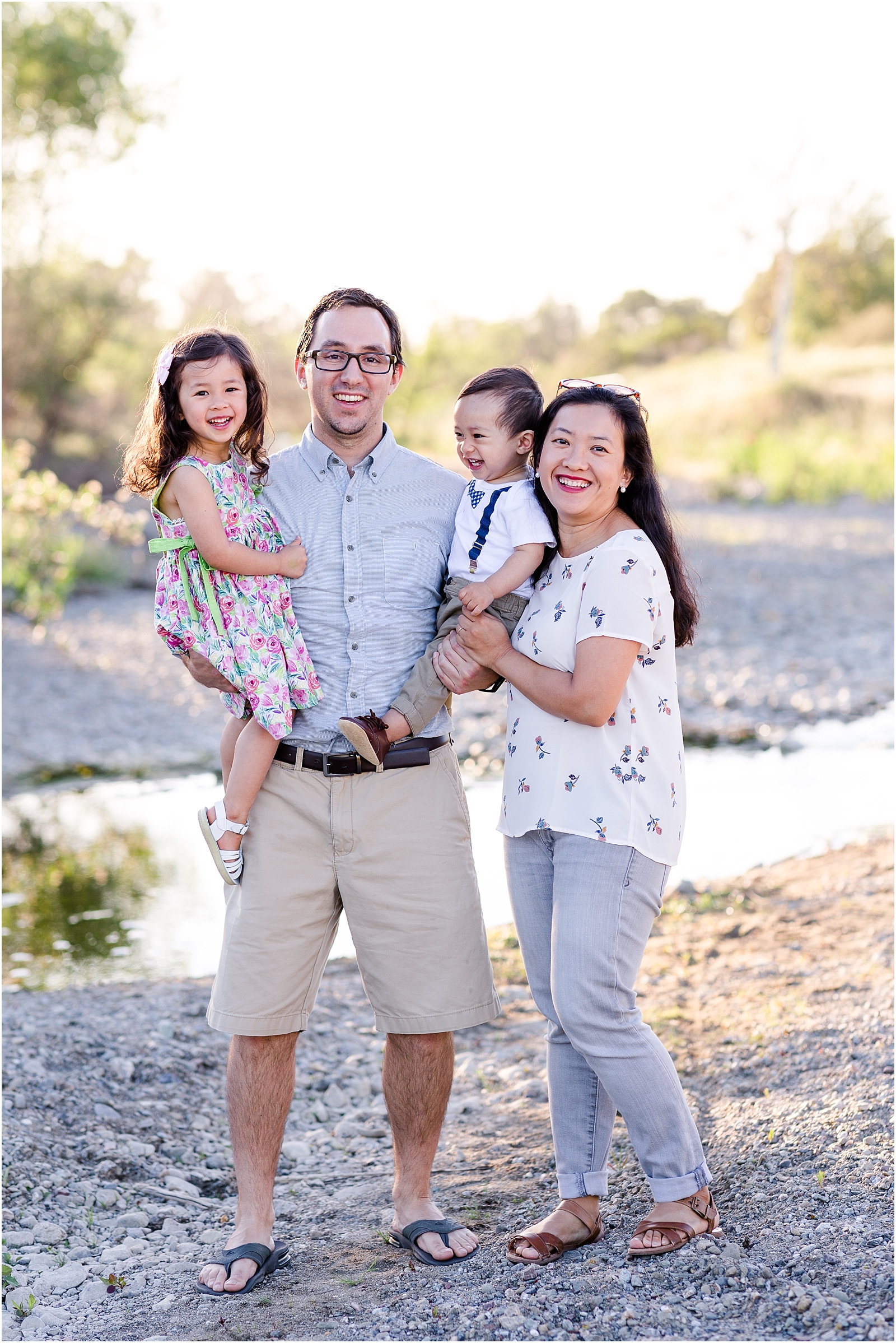 Family photo on the Arroyo Mocho Trail in Livermore, CA: dad, mom, son, and daughter smiling and laughing