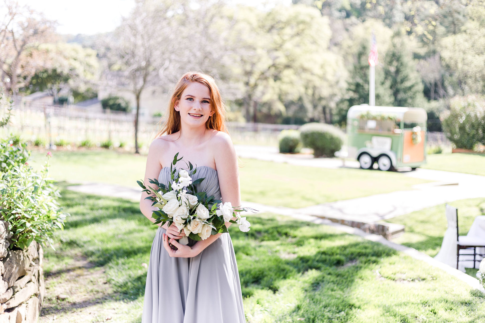 Maid of honor with white floral bouquet