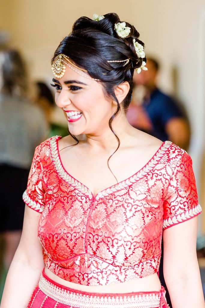 Indian bride smiling after getting hair and makeup done at Napa Silverado Resort, shot by Amber Rivas Photography
