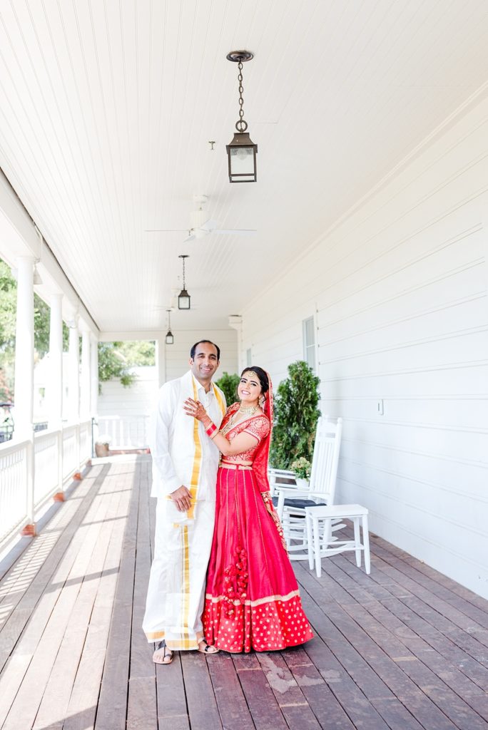 Indian bride and groom standing on the deck at the Napa Silverado Resort, shot by Amber Rivas Photography