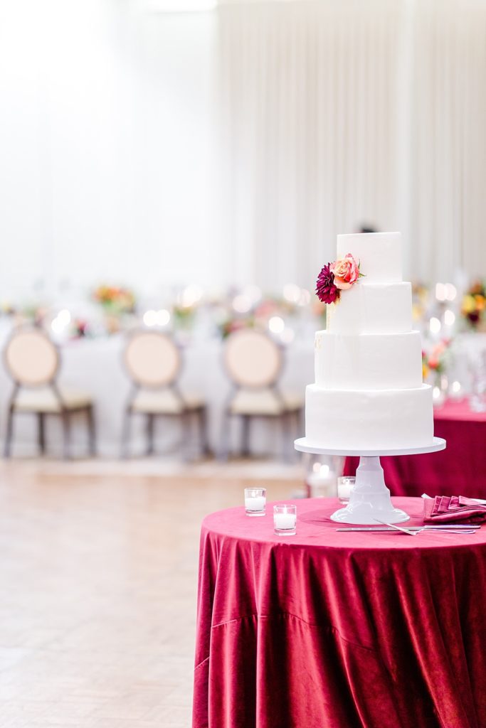 Indian wedding reception at Napa Silverado Resort,cake with gold foil and flowers, shot by Amber Rivas Photography