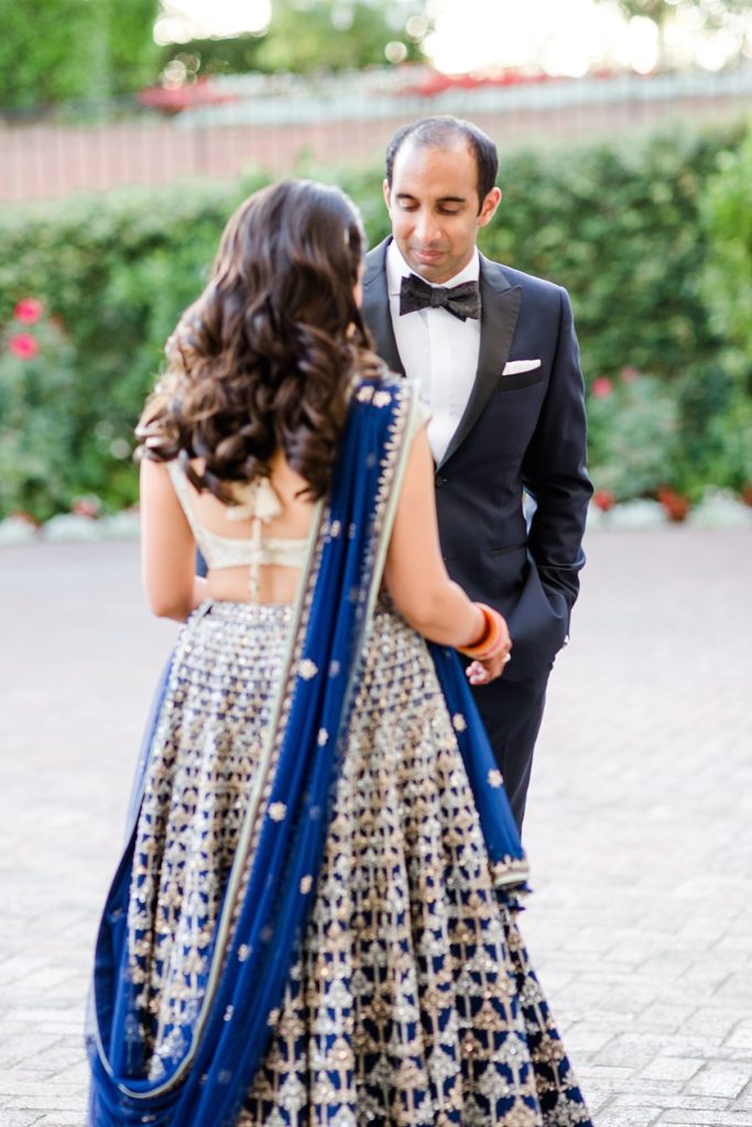 Groom gets first look of second gown for Indian wedding reception at Napa Silverado Resort, shot by Amber Rivas Photography