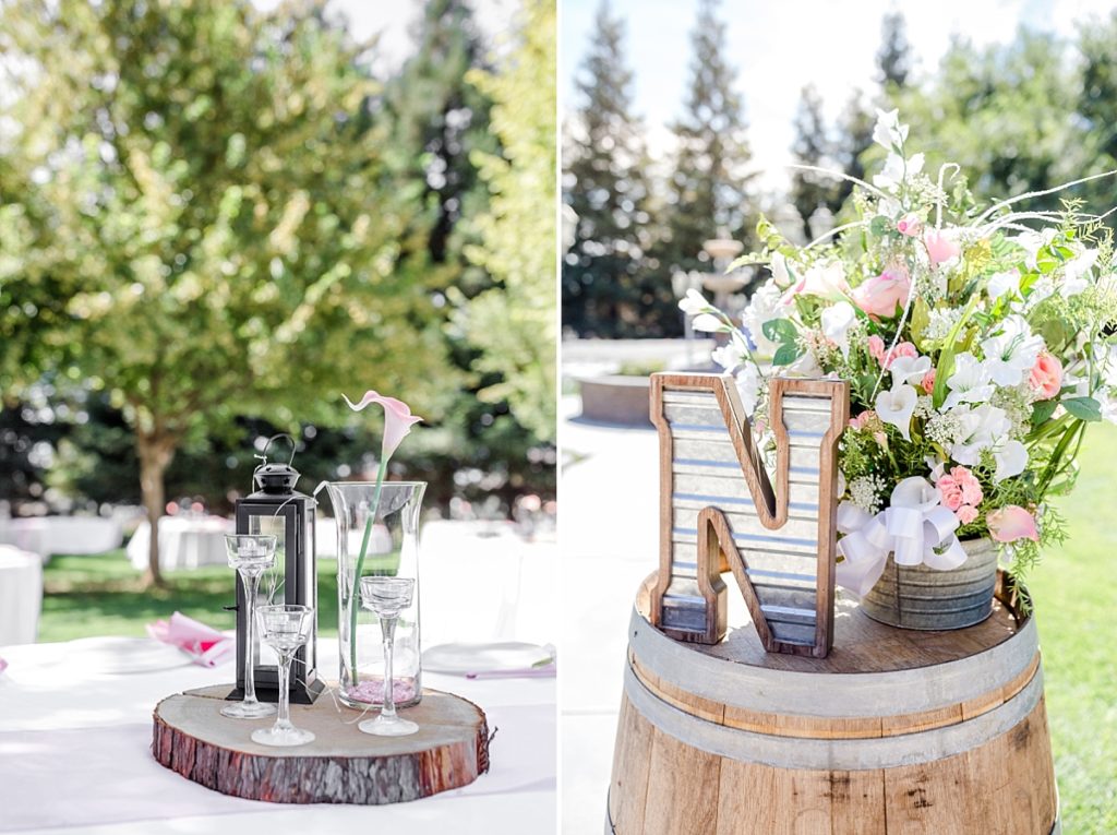 Rustic decorations at a wedding ceremony in the Central Valley of California. Wine barrel with letter and flower, wood cut centerpiece. Shot by Amber Rivas Photography.