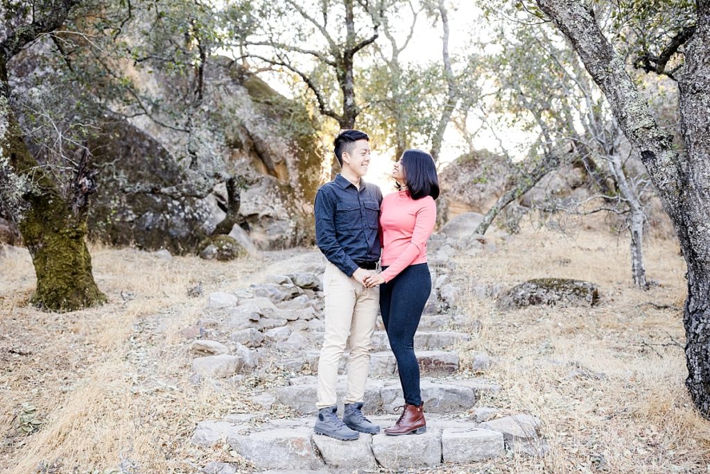 Couple on the stairs at Mt Diablo Rock City. Mt Diablo engagement photos taken by Livermore photographer.