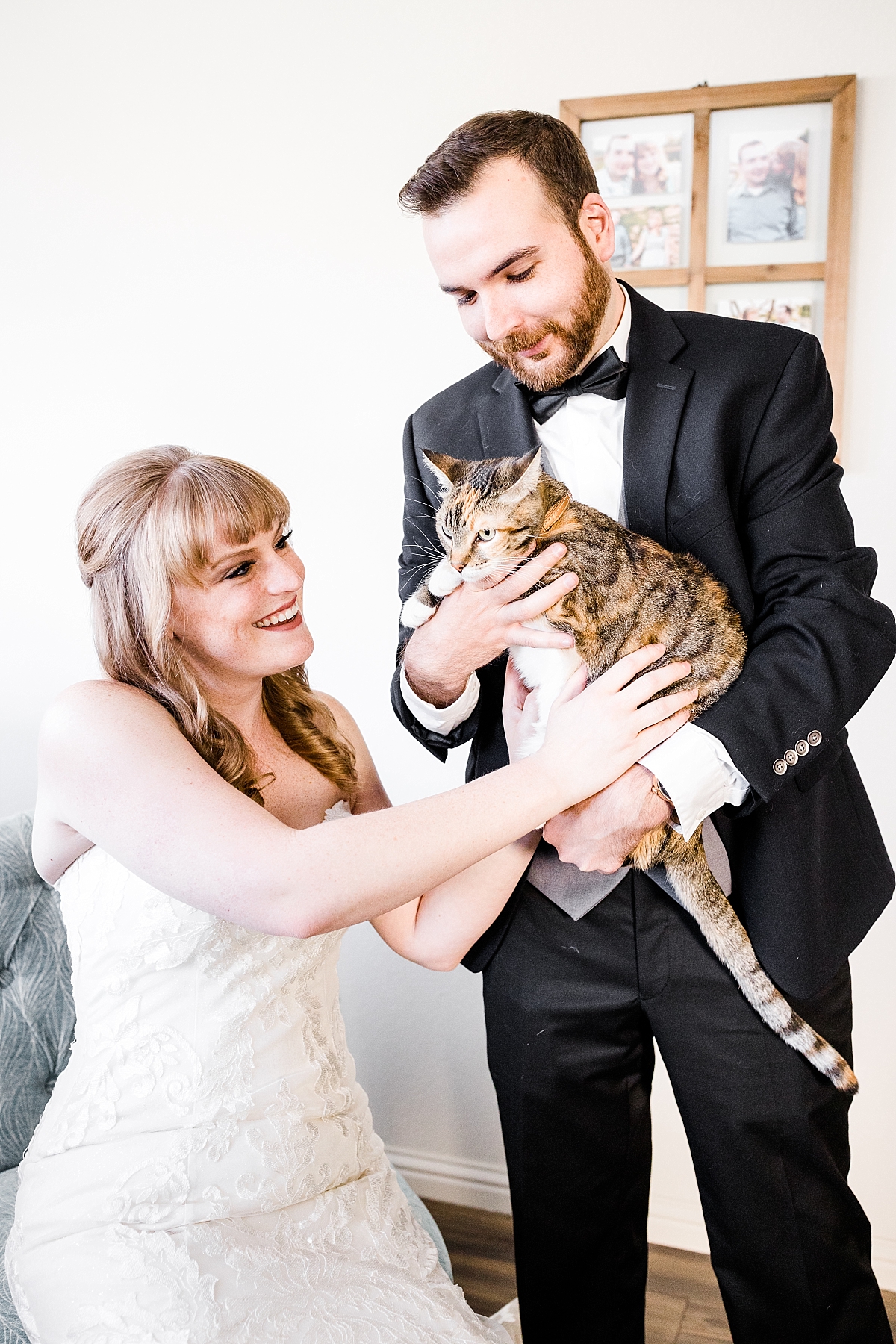 Bride and groom with their cat.