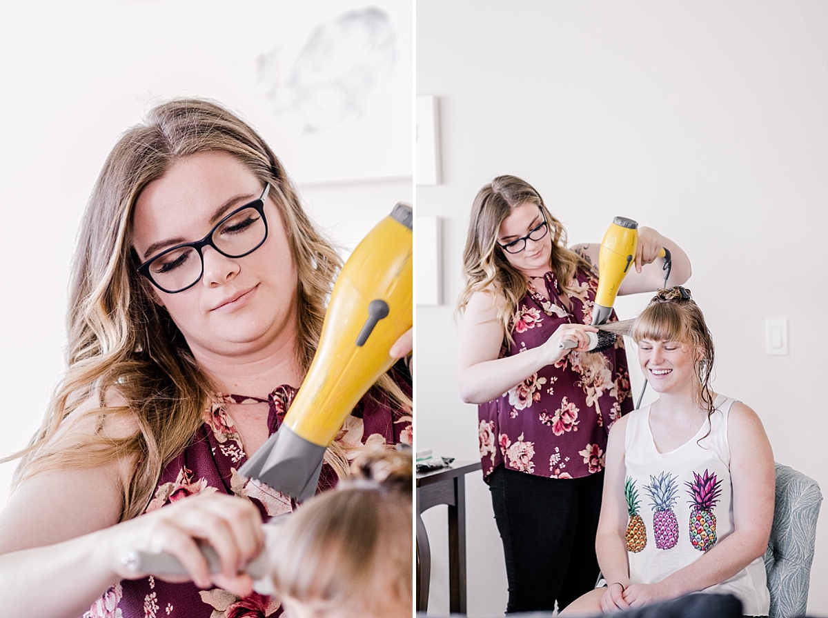 Hair stylist doing hair.