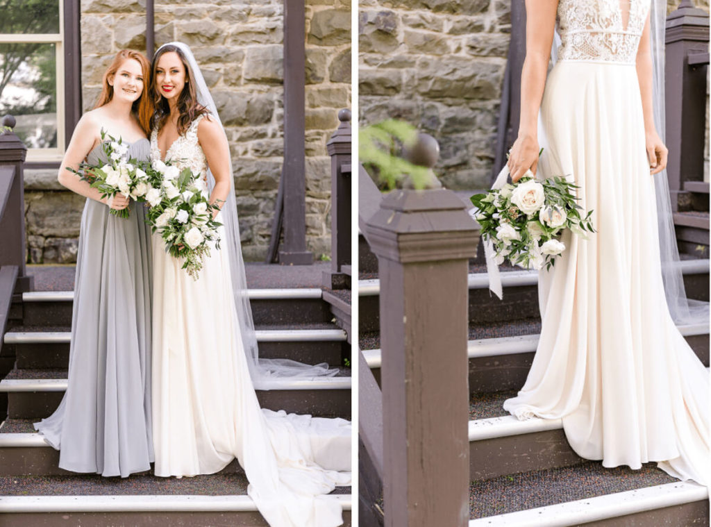 Bride and maid of honor on steps holding white floral bouquets