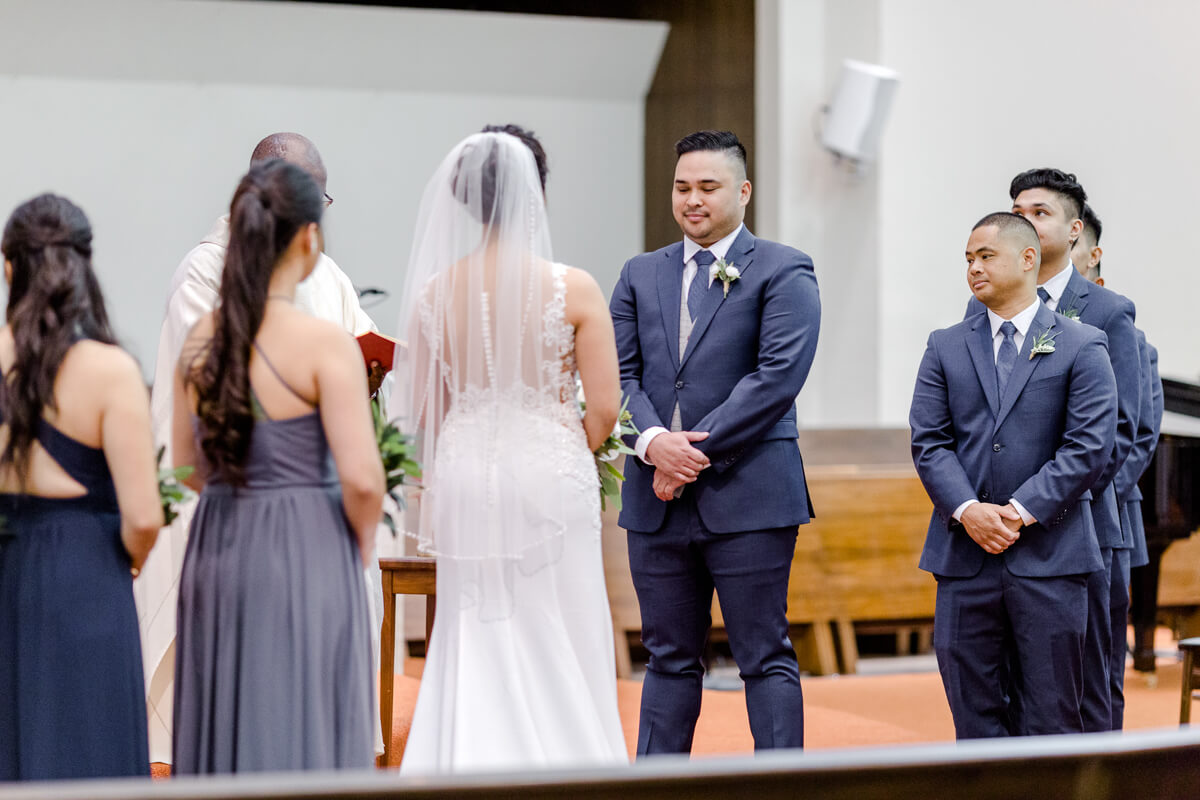 Wedding ceremony, groom looks at bride