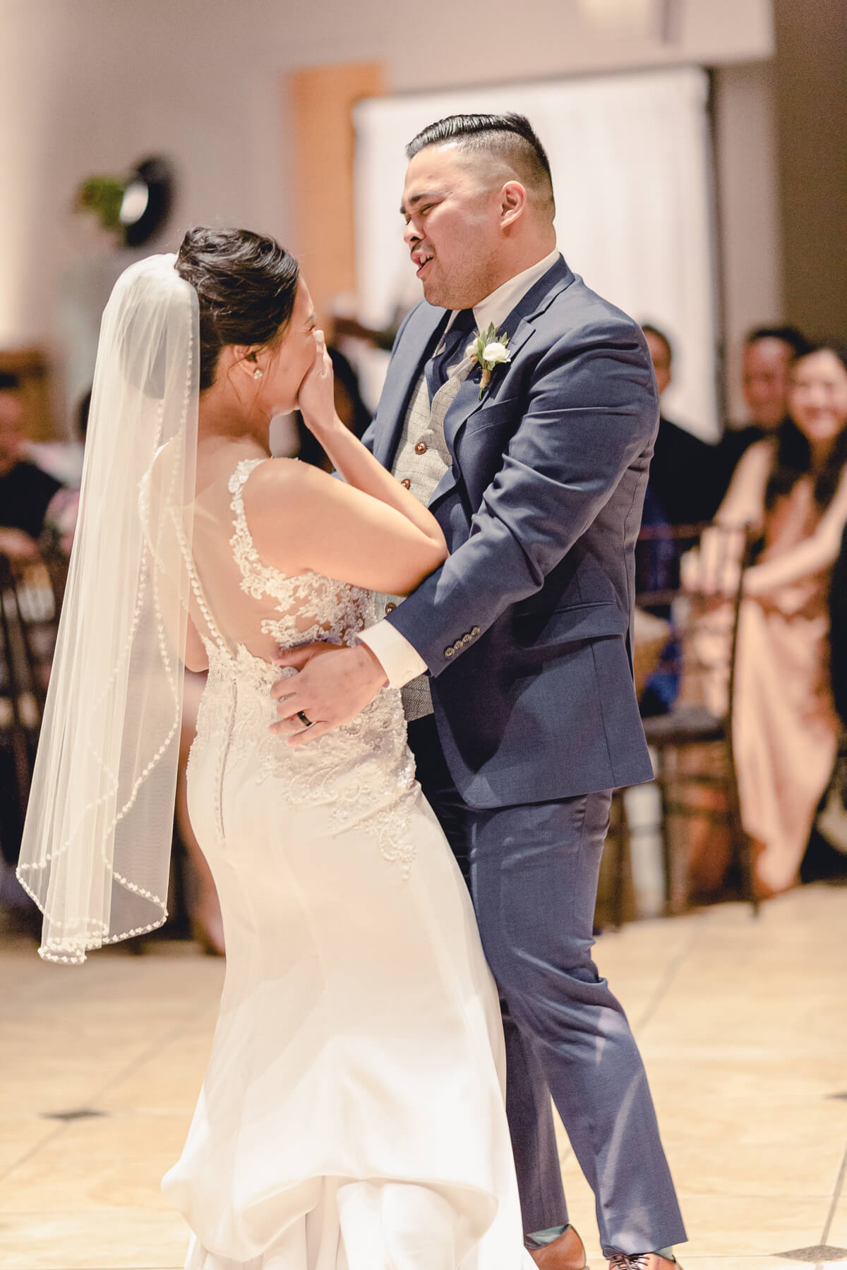 Bride and groom share a first dance during their Palm Event Center winter wedding