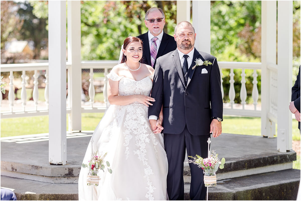 Bride and groom are married at Ravenswood summer wedding